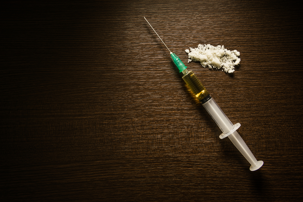 Drug syringe and cooked heroin