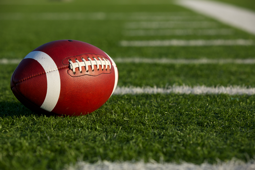 American Football on the Field near the hashmarks or yard lines