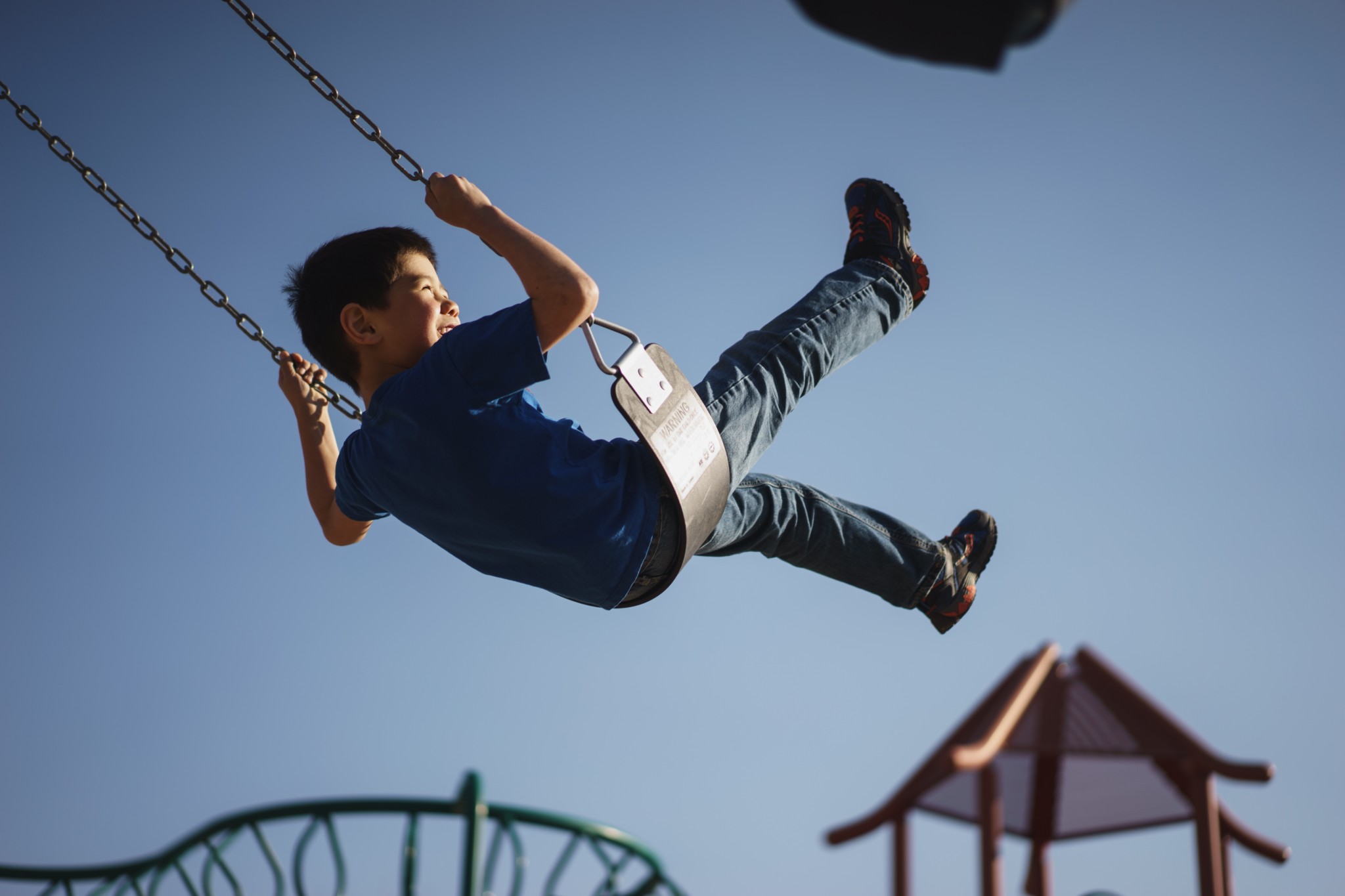 Kid Swinging at park