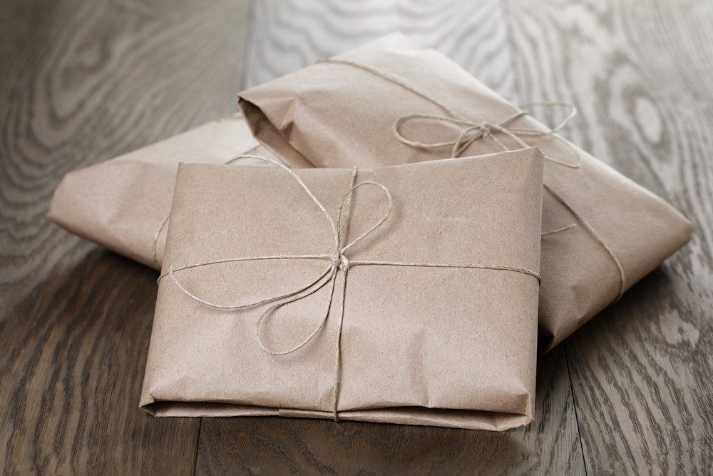 vintage style parcels wrapped with rope, on old oak table