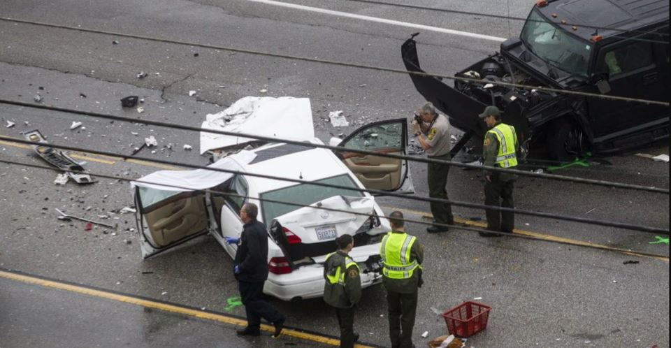 State troopers inspecting car accident on highway