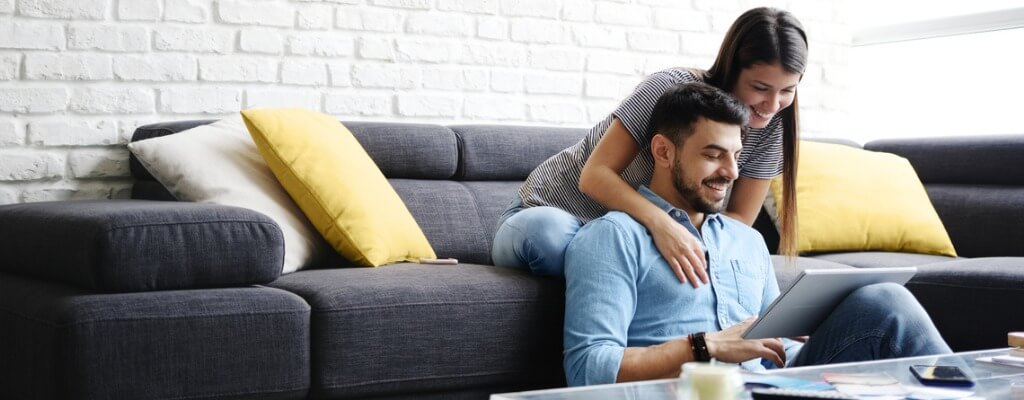 Boyfriend and Girlfriend watching Youtube on a tablet together