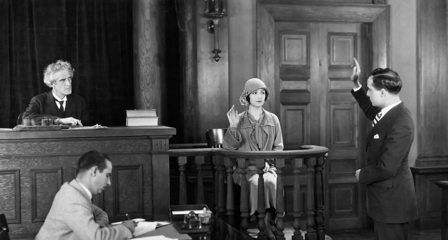 A Lawyer swearing in a witness in court