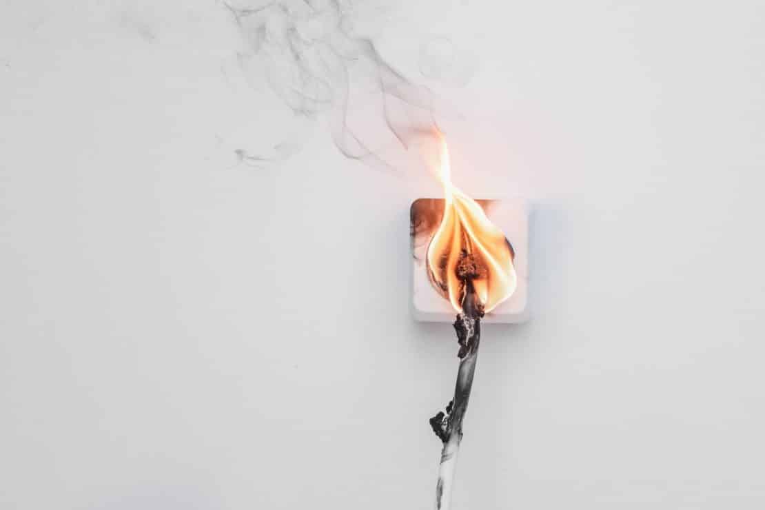 An electrical socket that is on fire