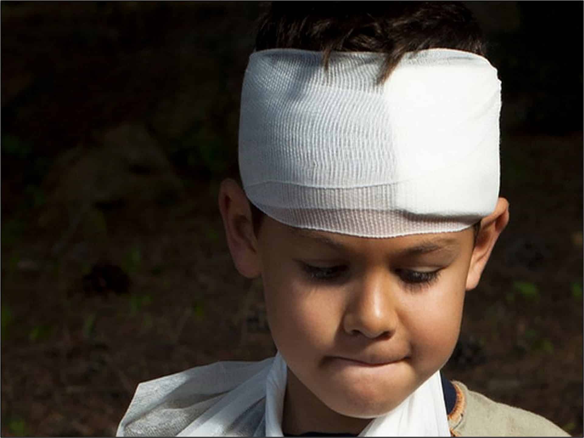Kid with a head injury, bandaged