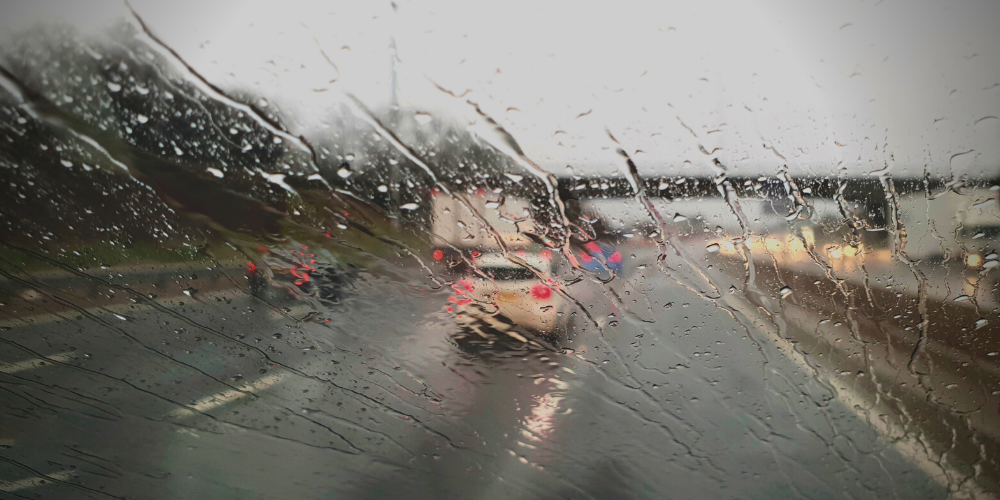 POV, you're driving in the rain on the highway