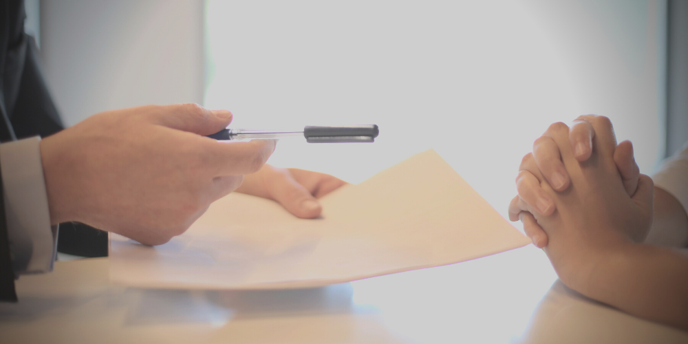 Lawyer discussing case with client in office