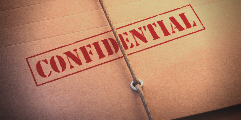 a file, stamped "confidential" on the front