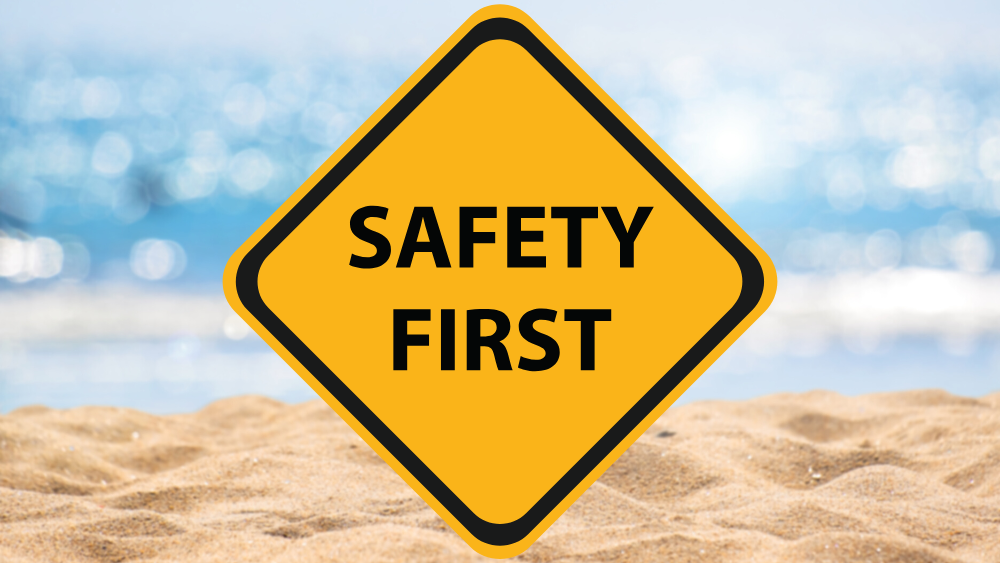 A yellow diamond road sign that reads "safety first"